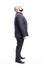 A bald man in a suit looks up. Side view. Full height.  on a white background.