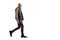 Bald punk man in leather clothes walking