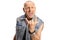 Bald rocker man in a denim vest posing and gesturing rock and roll sign