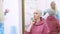 Bald woman at a consultation with a doctor in a clinic. The concept of trichology, oncology, alopecia.