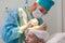 Baldness treatment. Hair transplant. Surgeons in the operating room carry out hair transplant surgery. Surgical