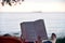 Bale / Croatia - 7/18/2019: Person reading a book on the beach.