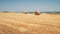 Bale hay on yellow mown field close-up. Beautiful calm landscape. Harvest, preparation eco straw.