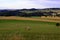 Bale of hays on meadow field on hillside