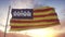 Balearic Islands flag, Spain, waving in the wind, sky and sun background