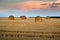 bales roll and stubble in the field at evening time, harvesting in agriculture