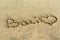 Bali beach writing in sand