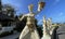 Bali, Indonesia - 06 July 2022: Sculpture of Balinese dancers at the entrance to Pantai Melasti Beach under the blue sky