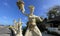 Bali, Indonesia - 06 July 2022: Sculpture of Balinese dancers at the entrance to Pantai Melasti Beach under the blue sky