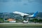 Bali, Indonesia - April 30, 2019: Dehong South Asian Airlines plane on Denpasar Airport runway