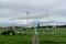 BALI/INDONESIA-DECEMBER 21 2019: some airport cleaners cut grass around the runway using a lawn mower and several tractors when