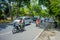 BALI, INDONESIA - MARCH 08, 2017: Unidentified people driving motorcycles and cars in the road full of traffic. The