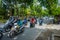 BALI, INDONESIA - MARCH 08, 2017: Unidentified people driving motorcycles and cars in the road full of traffic. The