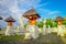 BALI, INDONESIA - MARCH 11, 2017: Entrance of an Indu temple in Ubud, with some straw huts located in the backyard in