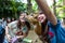 Bali, Indonesia - March 22, 2018: Women making selfie with deer in Bali Zoo