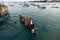 BALI/INDONESIA-MAY 15 2019: some people are in a traditional Indonesian-flagged boat. This traditional boat prepares to sail from