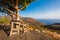 Bali, Island Crete, Greece, - June 25, 2016: Beautiful morning scenery with two wooden benches near the tree. Benches are installe