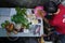 BALI, JUL 29 2021: A mother and her toddler are washing vegetables, fish and fruits they bought from the market using soapy water