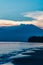 Bali seascape at sunset with blue sky and orange clouds and Java volcano