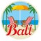 Bali tourist sticker. Sun beds and umbrella on the beach