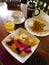 Balinese breakfast of fruit, vegetables, eggs and coffee