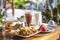 Balinese breakfast served on a table with food, fruits and colourful smoothie