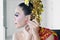 Balinese dancer wearing earrings on her ears