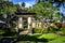 Balinese doorway and architecture and fountains with trees and flora surrounding it