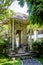 Balinese doorway and architecture and fountains with trees and flora surrounding it