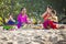 Balinese family prayed in front of Kuta Beach, Bali, Indonesia.