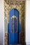 Balinese golden and blue painted luxury door with ornamental carvings