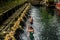 Balinese people praying in holy spring water of sacred pool at P