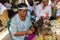 Balinese preparing for temple religious ceremonial offering