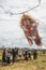 Balinese teenagers launching huge kite