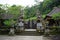 Balinese temple carved in stone gate entrance with plants