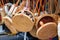 Balinese traditional handmade rattan woven round shoulder bags with leather handles at a souvenir street shop. Bali, Indonesia