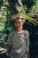 Balinese woman carrying leafs on the head, Ubud