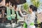 Balinese woman doing ritual offering canang sari and praying at