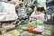 Balinese woman praying at temple on small shrines in houses