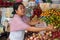 Balinese woman selling tropical fruit in a market in Bali