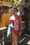 A Balinese woman in traditional clothes on Hindu Temple ceremony, Bali Island, Indonesia