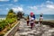 Balinese women carrying baskets with offerings to a temple at Pura Tanah Lot, Bali Island, Indonesia