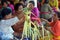 Balinese women preparing Traditional Hindu offering decoration in Bali Indonesia