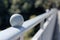 A ball on bridge fence