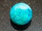 Ball from Chrysocolla gemstone on dark