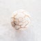 ball from cracked Cacholong gemstone on white