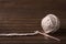 Ball of cream yarn with crochet hook