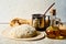 Ball of dough on the kitchen table, olive oil in a bottle. Kneading pizza dough. Rustic bread, homemade