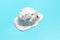 A ball of ice cream fell on a blue background, view from the side