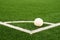 Ball prepared for corner kick. Heated football playground. corner on artificial green turf ground with painted white line marks.